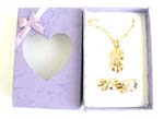 Gold cross jewelry set embedded mini clear cz , matched with a pair of earring and a purple gift box included