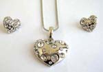 Heart shape pendant with clear cz inlaid, suspended on a snake chain, included a matching pair of post back earrings