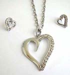 Heart love shape frame pendant suspended on a snake chain, included a matching a set of studs earrings