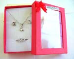 Fashion jewelry box set, silver plated necklace, stud earring and ring with filp over V shape holding a clear cz design. Spring ring clasp 