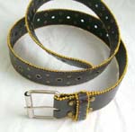 Black leather belt with golden beaded on top and bottom