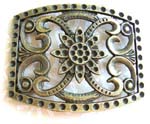Belt buckle in rectangular shape motif a flower in the middle and curvy line on each side