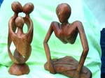 Assortment wooden abstract carving in genetic, yoga and kissing couple design