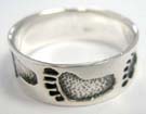 Crafted foot print theme etched into 925. sterling silver band