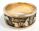 Egyptian art styled design on thick bronze band