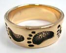 Men and womens bronze band with foot print design 