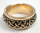 Bronze ring with triangular celtic knot band in center 