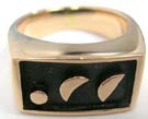 Half moon and circle shaped on black colored backing to mens bronze ring