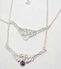 Beautifully crafted 925. sterling silver necklace with vine holding heart design and cz crystal in center 