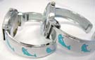 Enamel dolphins on frame of silver bangle bracelet and on heart shaped clock frame of trendy watch 