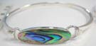 Opal colored gemstone in elongated oval shape on 925. sterling silver bangle bracelet