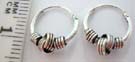 Handcrafted 925. sterling silver hoop earrings with artist inspired curled wrap around coil