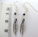 Single leaf charm dangling from 925. sterling silver dream catcher earrings with black onyx in center