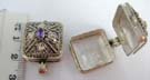 Antique designed 925. sterling silver locket with amethyst set in center of flower design and framed by beaded pattern
