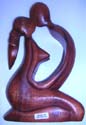 Kneeling down kissing couple abstract carving 