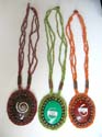 Multi color beaded necklace holding a dye color seashell spiral pendant
