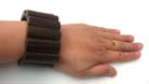 Rectangular wooden beads create dark brown bracelet