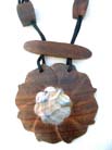 Fashion flower inspired pendant with mother of pearl seashell in center on black string necklace with wood beads 