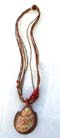 Spiral seashell pendant on multi brown cord necklace with red beads 