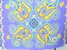 Yellow paisley flower pattern on purple crafted pareo wrap 