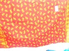 Yellow gecko pattern on red bali bali wrap skirt 