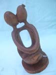 Kissing lovers theme wooden statuette