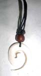 Indonesian sculpted new age pendant on black cord necklace