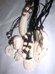 Indonesian sculpted new age pendant on black cord necklace