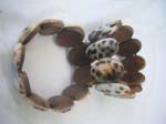 Crafted oval section with leopard print design on stretch wood bracelet 