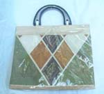 Ladies tote bag with solid black handles and diamond design on front 