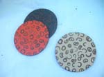 Circular shaped crafted coaster set with black designs