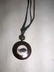 Artist made, wooden pendant with ivory colored center design on black cord necklace