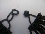 Multi string, black beaded necklace in wave fashion design 