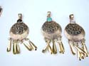 Antique style bronze pendant with gem embedded on top and dangling rods at bottom